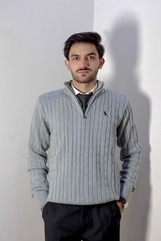 Man wearing a gray sweater with a white background